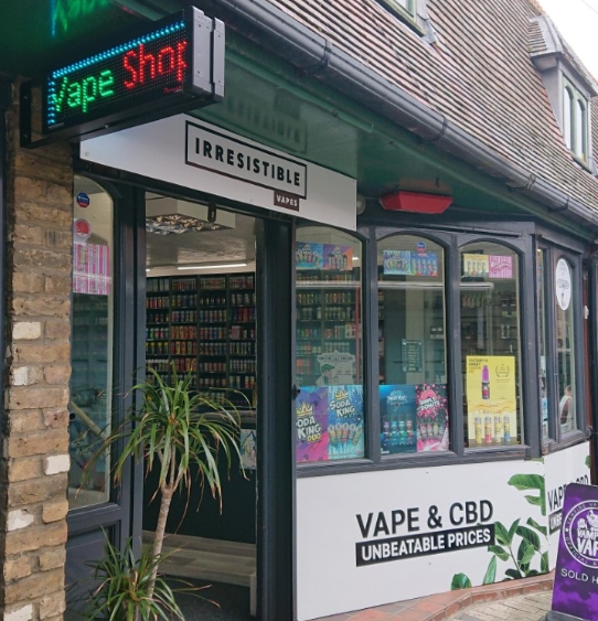 Storefront of Irresistible Vapes displaying various vape and CBD products including brands like Elfliq, Elux, Prime, and Ohm Brew – Retail by Irresistible Vapes, Vape pod retailer Rochester UK